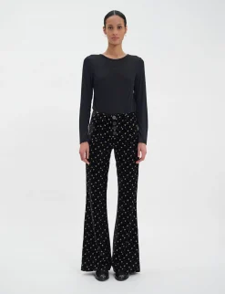 Shop Ines de la Fressange Paris Charlotte trousers in smooth black velvet with gold print